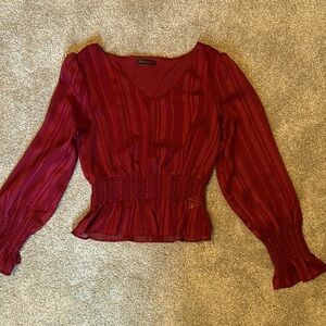 Shinestar burgundy smocked neck, waist, and cuffs sheer top. Size small.